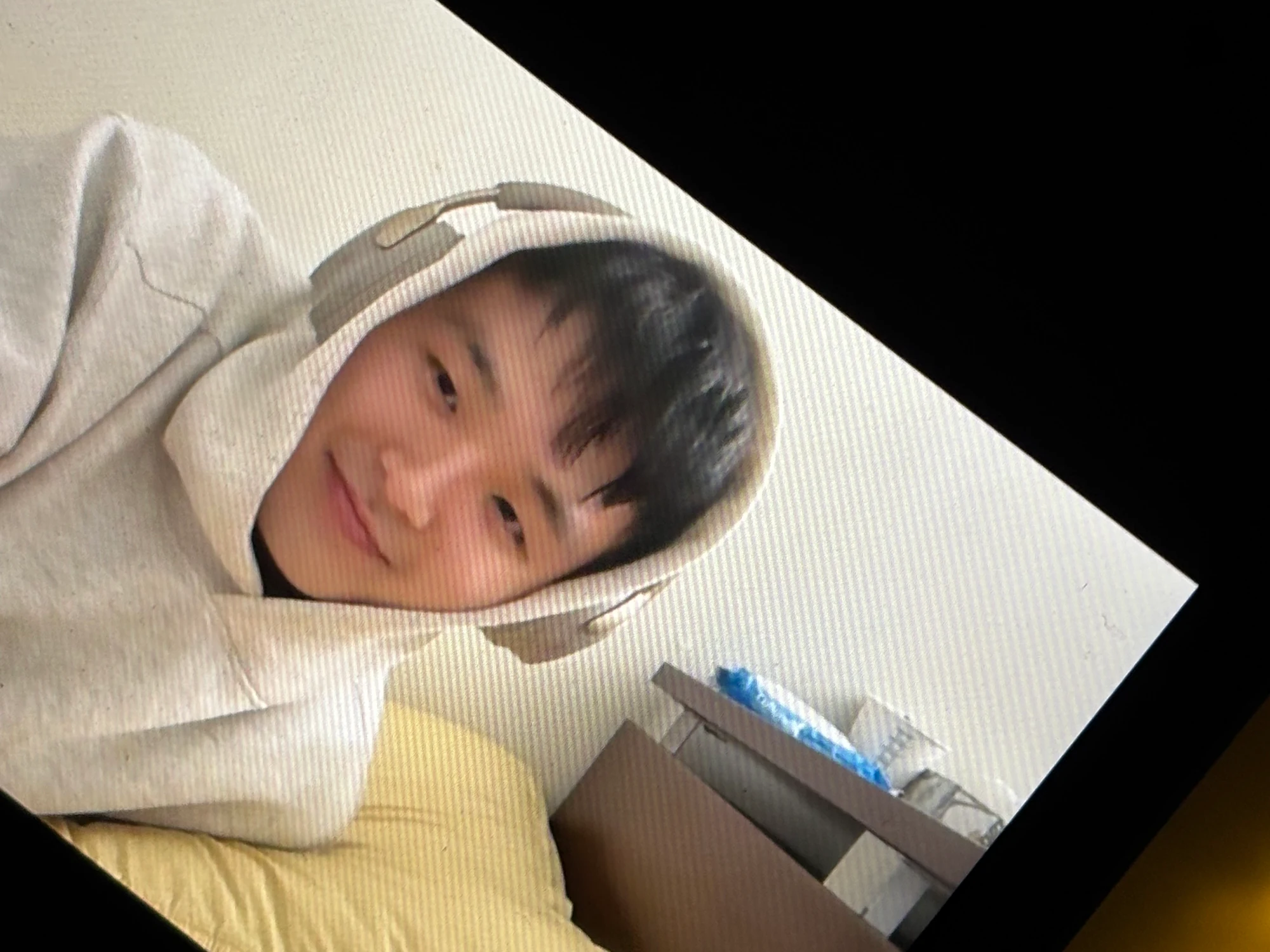 dae in a grey hoodie