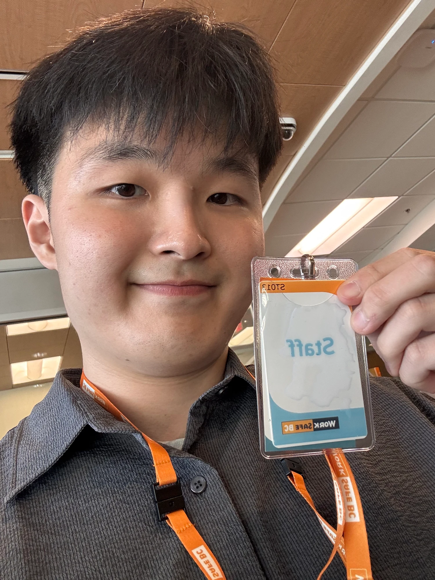 Dae holding his WorkSafeBC staff badge